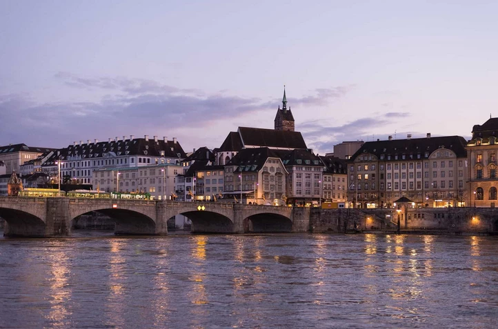 How to get weed in Basel - scenic view of the Rhine river and Basel cityscape for cannabis travel guide 2026
