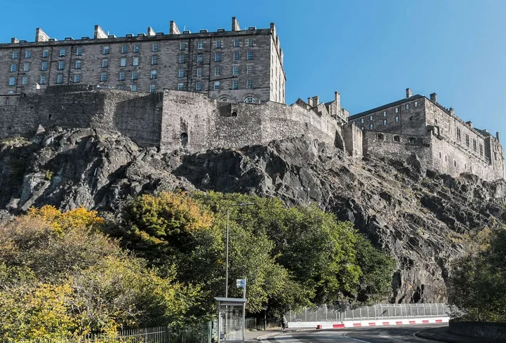Get weed in Edinburgh - scenic view of Edinburgh city with cannabis travel guide theme